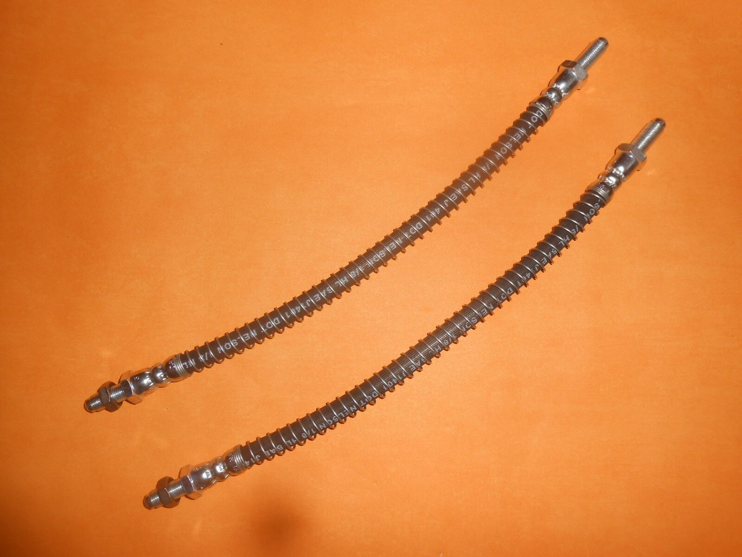 TRIUMPH TR6 (1968-1976) FRONT ARMOURED BRAKE HOSES PAIR + locking nuts