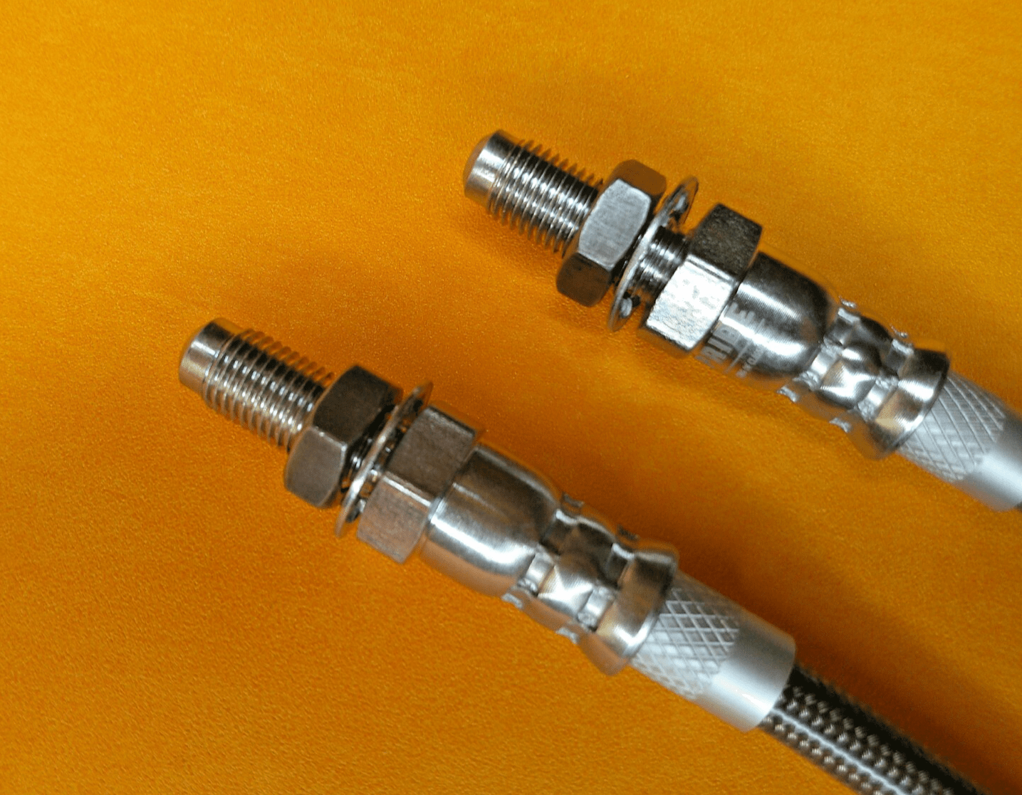 TRIUMPH GT6 (1970 - 1974) STAINLESS STEEL FRONT BRAKE HOSES PAIR - Vroom Classics