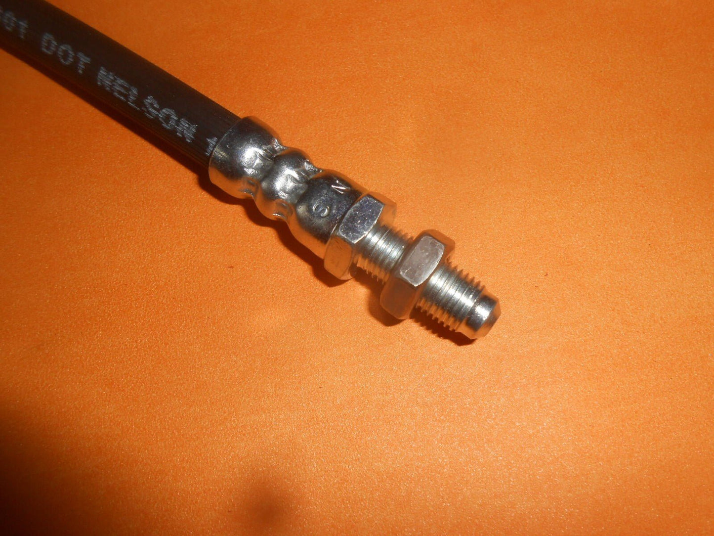 TRIUMPH TR4a, TR5, TR6 (1964 - 76) REAR LEFT BRAKE HOSE + locking nut - GBH177 - Vroom Classics